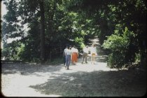 Residents walking up old beach road